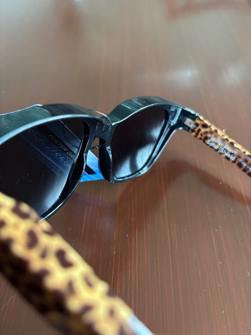 Foster Grant Solar Shield polarized,tortoise shell leopard arms,black frame/lens